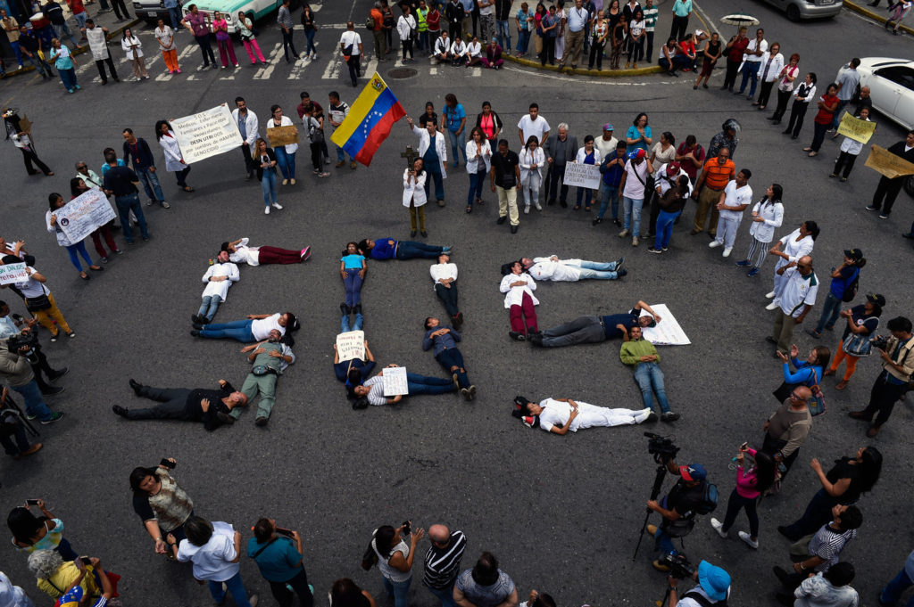 Dire conditions in Venezuela have forced the medical community to resort to protests that would have previously been inconceivable.  Photograph courtesy of Federico Parra / AFP / Getty Images.