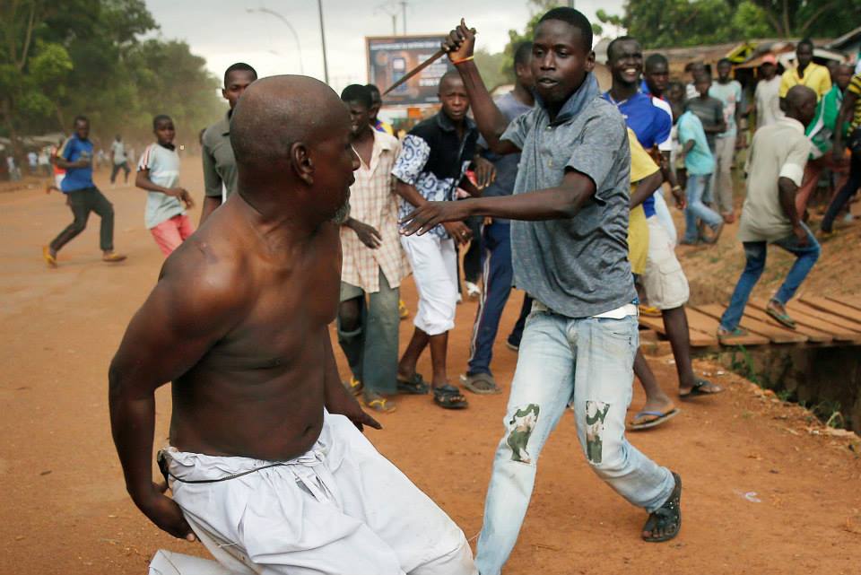 A Christian attacks a Muslim in the Central African Republic. The CAR has witnessed the displacement of 1 in 5 of its citizens and is now reportedly in stage 7 ("Preparation") of 10 in the 10 stages of genocide. Photo by Jerome Delay, AP.